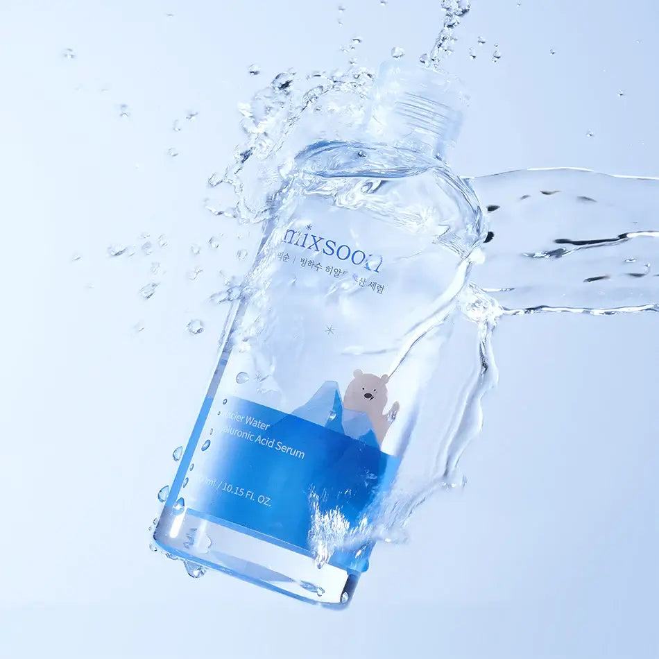 Mixsoon Ice Glacier Hyaluronic Acid Serum bottle splashing in water, showcasing intense hydration and lightweight texture.