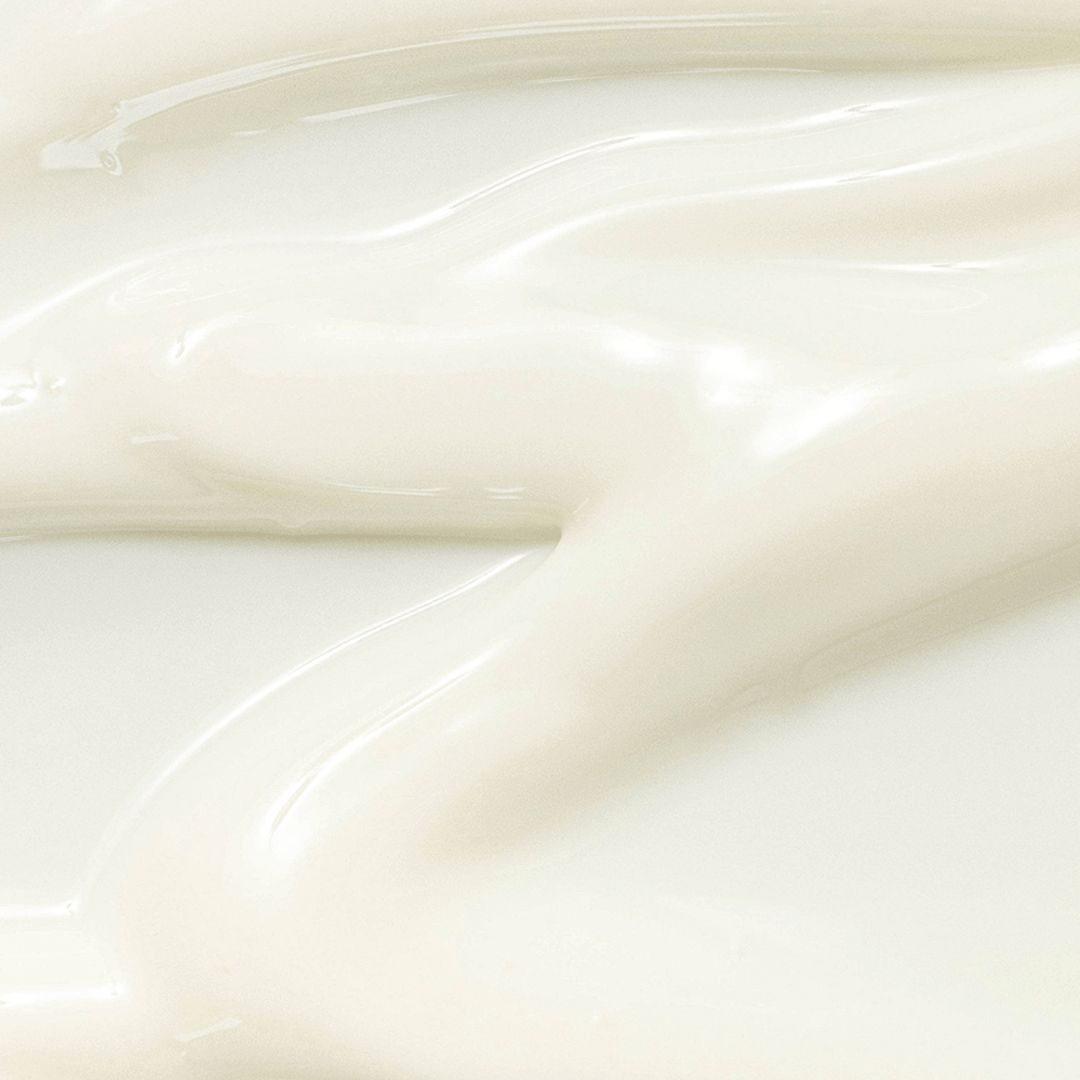 Close-up of creamy textured sunscreen, showcasing its lightweight formula without pilling or white cast.