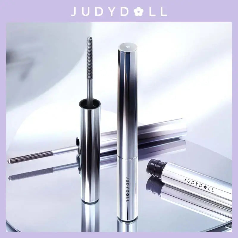 Judydoll 3D Curling Eyelash Iron Mascara with 360° brush for defined, curled lashes on a reflective surface.