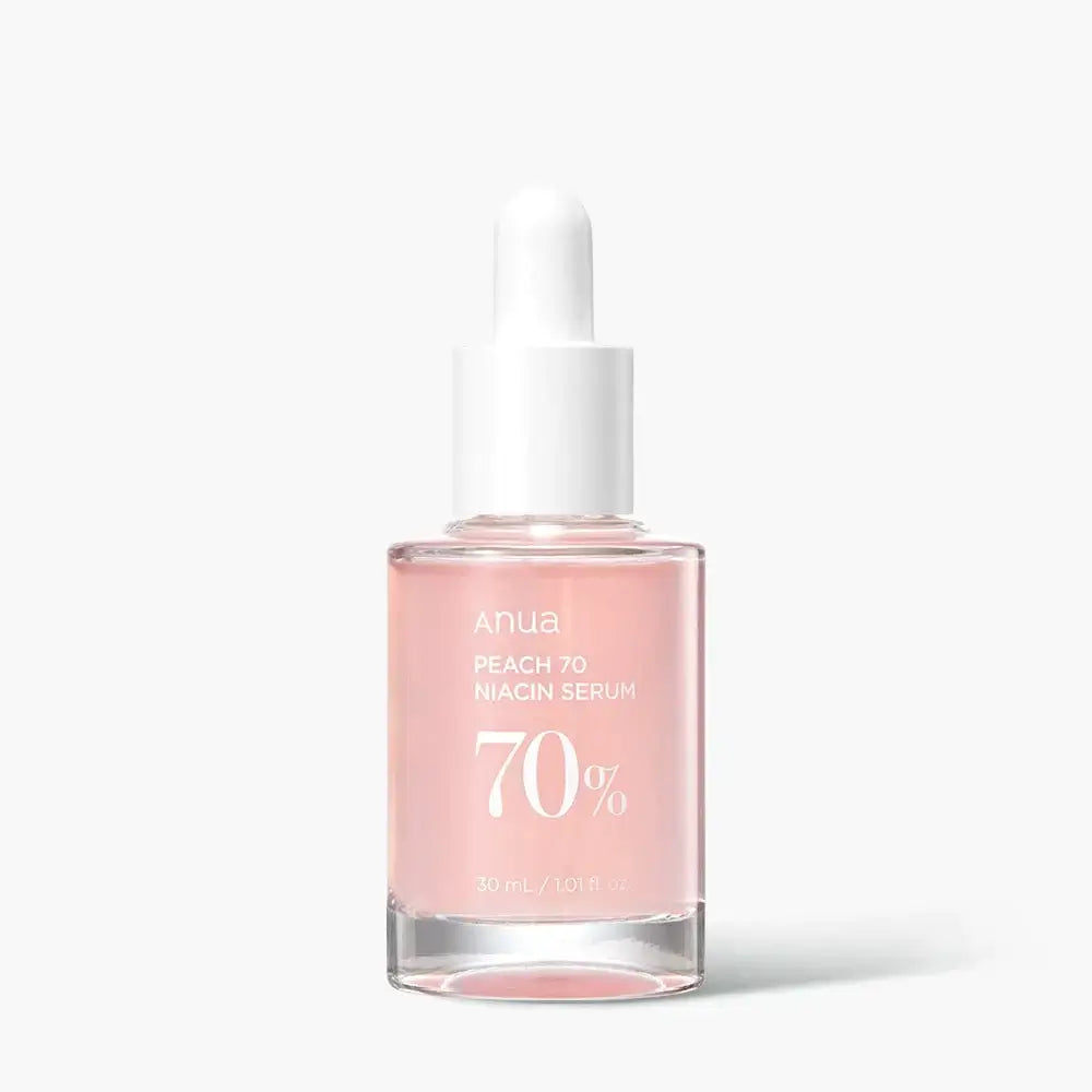 Anua Peach 70 Niacin Serum in a glass dropper bottle, featuring 70% peach extract and 5% niacinamide for brightening skin.