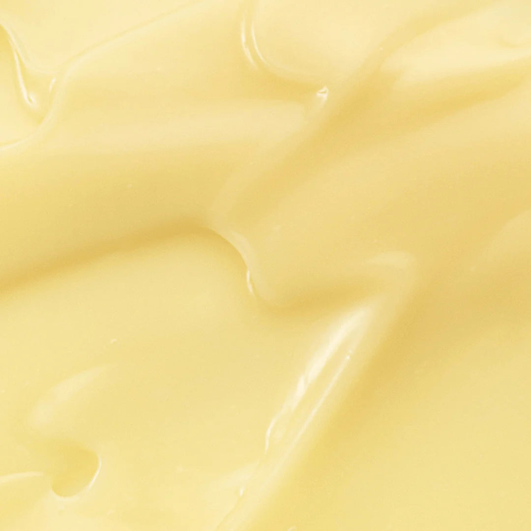 Close-up of the silky texture of Beauty of Joseon Revive Eye Serum with a yellow hue, showcasing its nourishing formula.