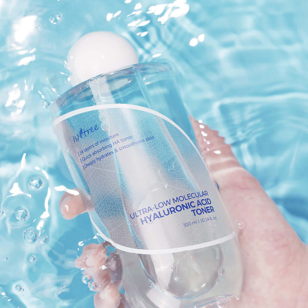 Isntree Ultra-Low Molecular Hyaluronic Acid Toner in water, promoting hydration and smooth skin.
