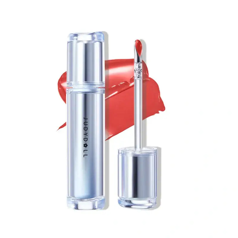 Judydoll Ice Watery Lip Gloss with metallic applicator and vibrant red color against a glossy backdrop.