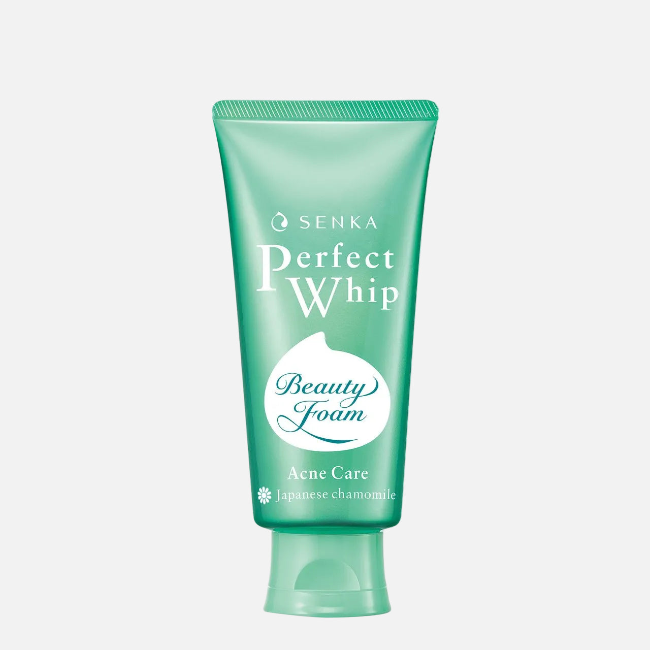 A squeeze tube of Senka Perfect Whip Beauty Foam Aene Care Japanese chamomile acne care foam, in a mint green color, on a plain white background.