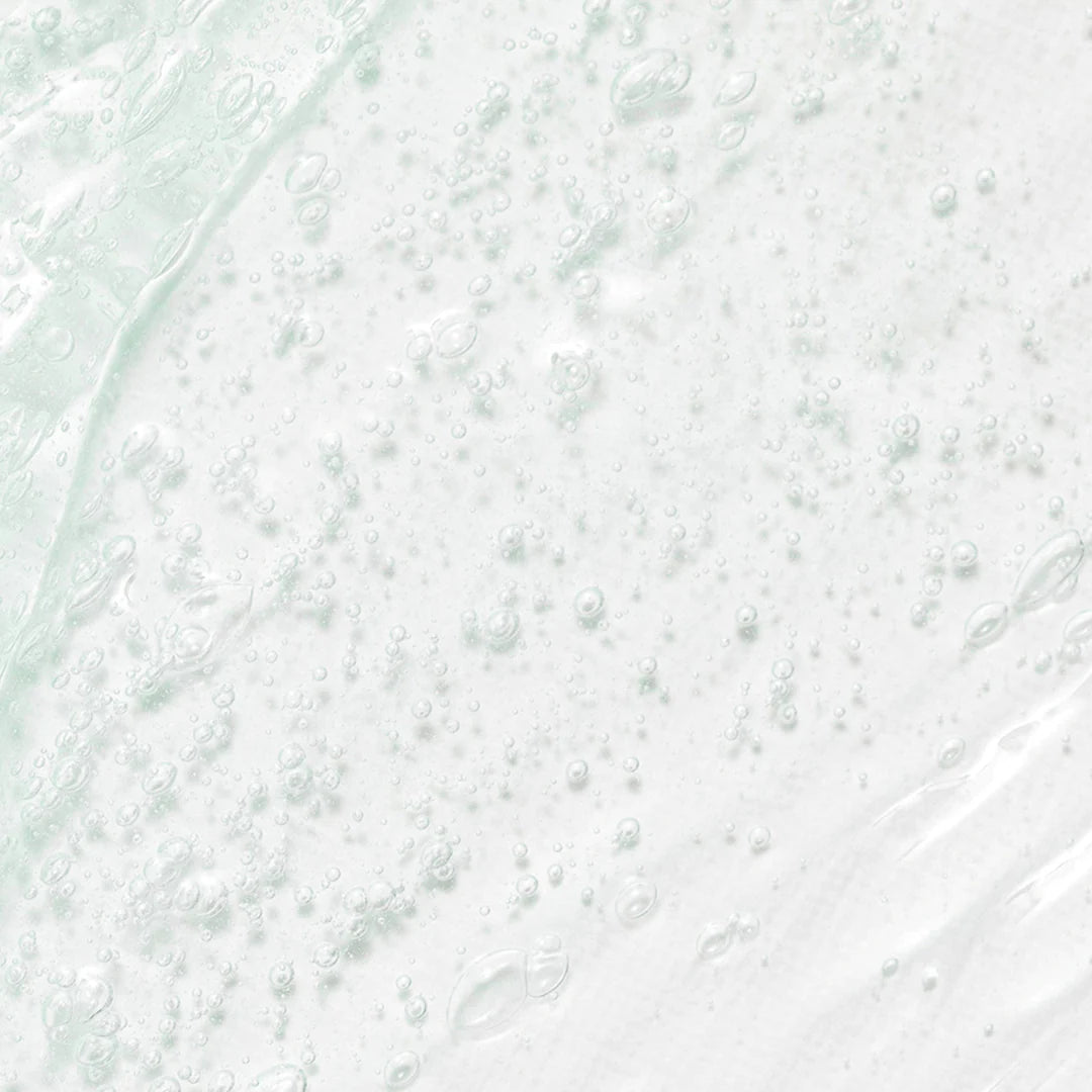 Close-up of Beauty of Joseon Green Plum Refreshing Cleanser showing a gel texture with bubbles, highlighting hydration and cleansing properties.