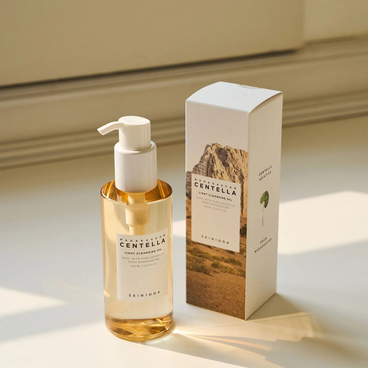 SKIN1004 Madagascar Centella Light Cleansing Oil in a bottle with packaging, perfect for gentle makeup removal.