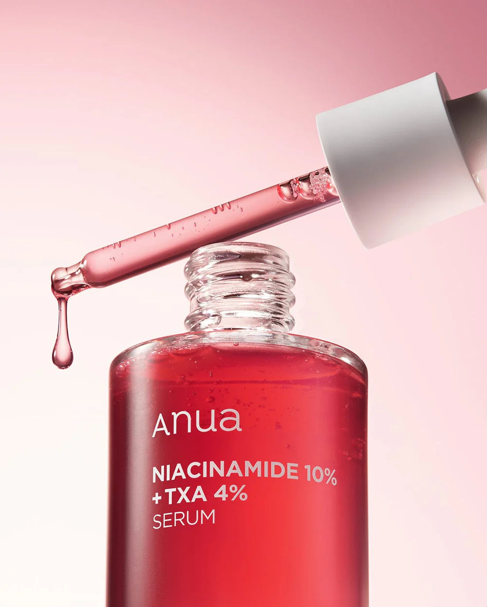 Anua Niacinamide 10% + TXA 4% serum in bottle with dropper, showcasing effective skincare for a radiant complexion.
